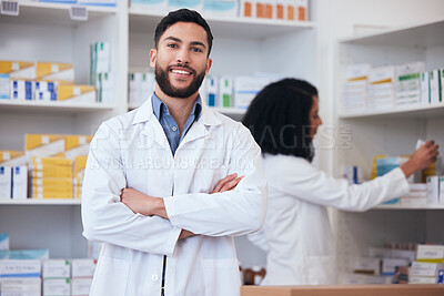 Buy stock photo Medicine, pharmacy and portrait of healthcare man at shelf with pills, stock or medication. Pharmacist person or medical staff with arms crossed and smile at pharmaceutical, drugstore or retail shop