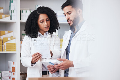 Buy stock photo Healthcare, medicine and a pharmacist team with a box of prescription or chronic medication in a drugstore. Medical, pharmaceutical product and a medicine professional in a pharmacy with a colleague