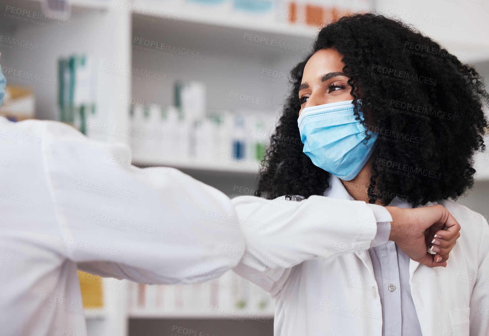 Buy stock photo Elbow greeting, face mask and doctors at a pharmacy for a hello, conversation or medical communication. Morning, nursing and people in healthcare with a handshake for safety from virus at a clinic