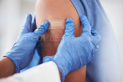 Buy stock photo Healthcare, vaccine and plaster on arm of person in hospital for covid, flu or immunization closeup, Doctor, hands and zoom on patient at a clinic for medical, consultation and disease vaccination