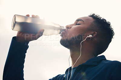 Buy stock photo Outdoor, fitness and man drinking water, exercise and hydration with wellness, nutrition or training. Person, athlete or runner with liquid, thirsty or outside with health, sports or cardio challenge