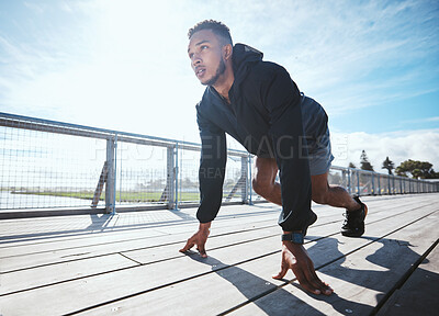 Buy stock photo Fitness, sports and a man at the start of his run in the city for cardio or endurance training. Exercise, bridge and a male runner or athlete getting ready for a marathon or running challenge outdoor
