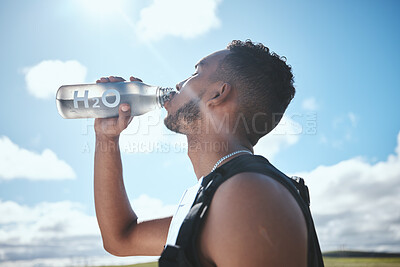 Buy stock photo Runner, man and drinking water outdoor for fitness, healthy body and wellness in nutrition. Hydration, liquid bottle and athlete in training, exercise and marathon in race competition at countryside