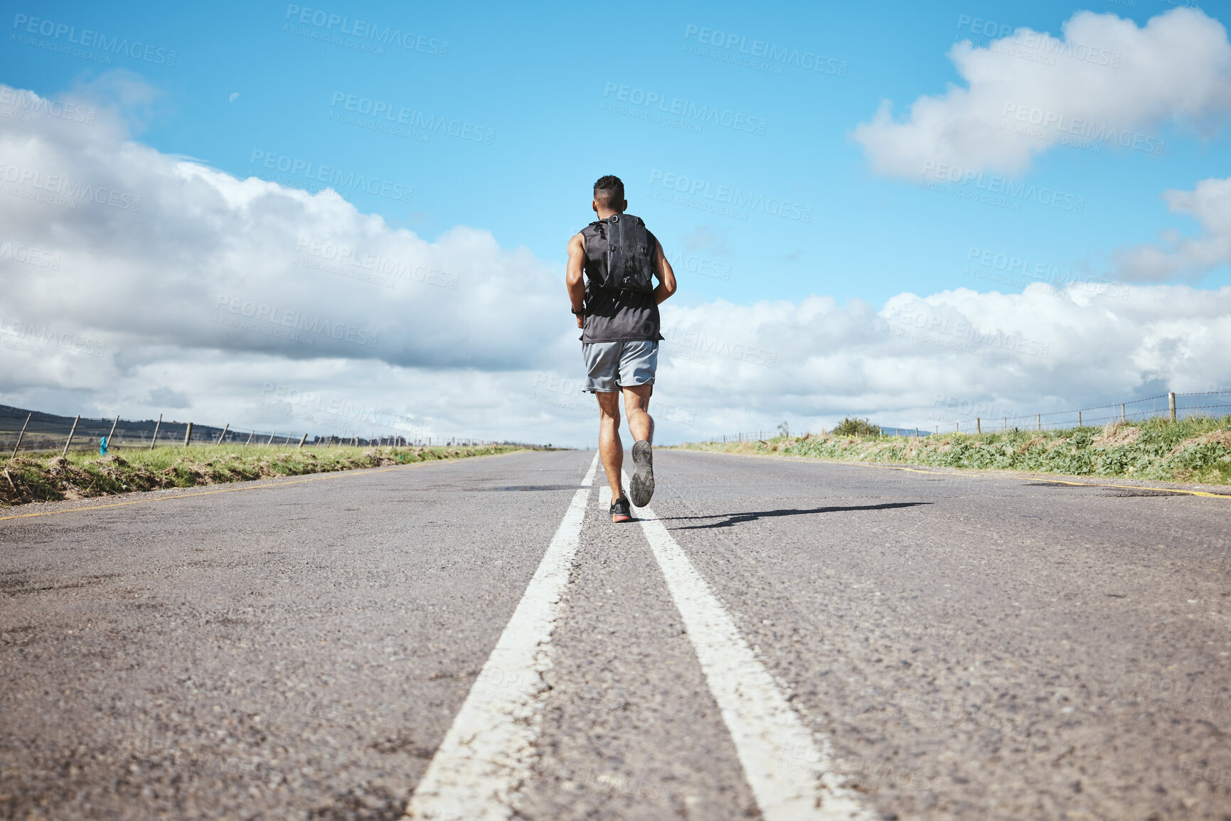Buy stock photo Back, marathon runner and man on road outdoor, cardio and healthy body. Athlete, training and fitness exercise in competition, workout sport or race on street in wellness at countryside mockup space