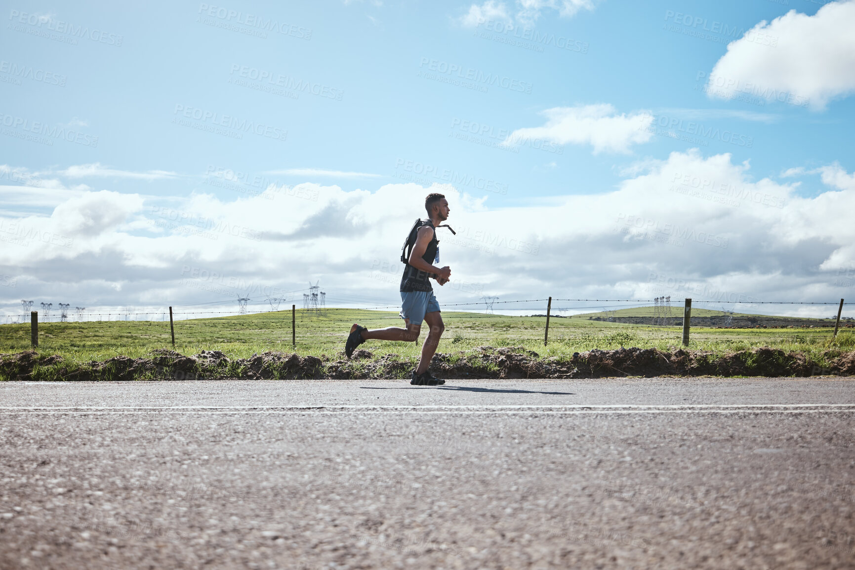 Buy stock photo Training, marathon runner and man on road outdoor, cardio or healthy body. Athlete, sport and fitness exercise in competition, workout energy or race on street in wellness at countryside mockup space