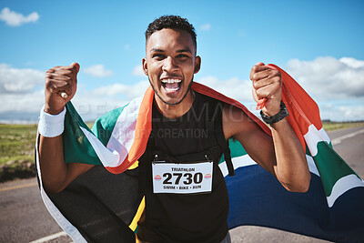 Buy stock photo Portrait, fitness and flag of South Africa with a man runner on a street in nature for motivation or success. Face, winner and health with a male athlete cheering during cardio or endurance training