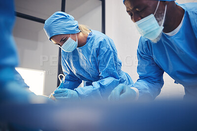 Buy stock photo Surgery team, hospital or surgeon operation, emergency services and doctors helping, support and focus on healing patient anatomy. Rescue, medical injury or healthcare group teamwork on saving client