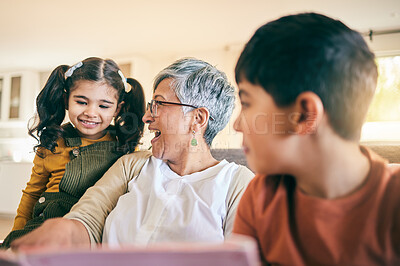 Buy stock photo Happy kids, smile or grandma reading a book for learning, education or storytelling on sofa at home. Family, senior or grandmother with children siblings for a fantasy story to enjoy bonding together