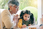 Teaching, grandma or girl learning drawing in book for creative skills or growth development. Senior, support or mature grandmother helping an artistic child to color in a school project or homework