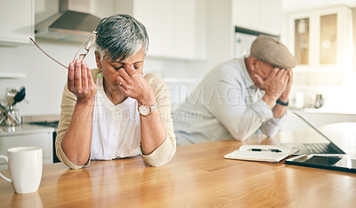 Buy stock photo Frustrated senior couple, headache and fight in divorce, debt or financial crisis together at home. Unhappy mature man and woman in stress, anxiety or depression in finance struggle, fail or mistake