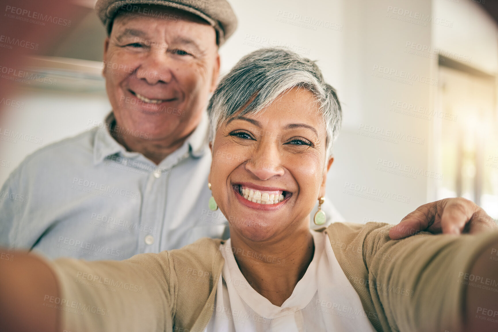 Buy stock photo Senior couple, face and selfie in home for love, smile and relax to bond in retirement together. Portrait of happy woman, elderly man and profile picture for social media post, photography and memory