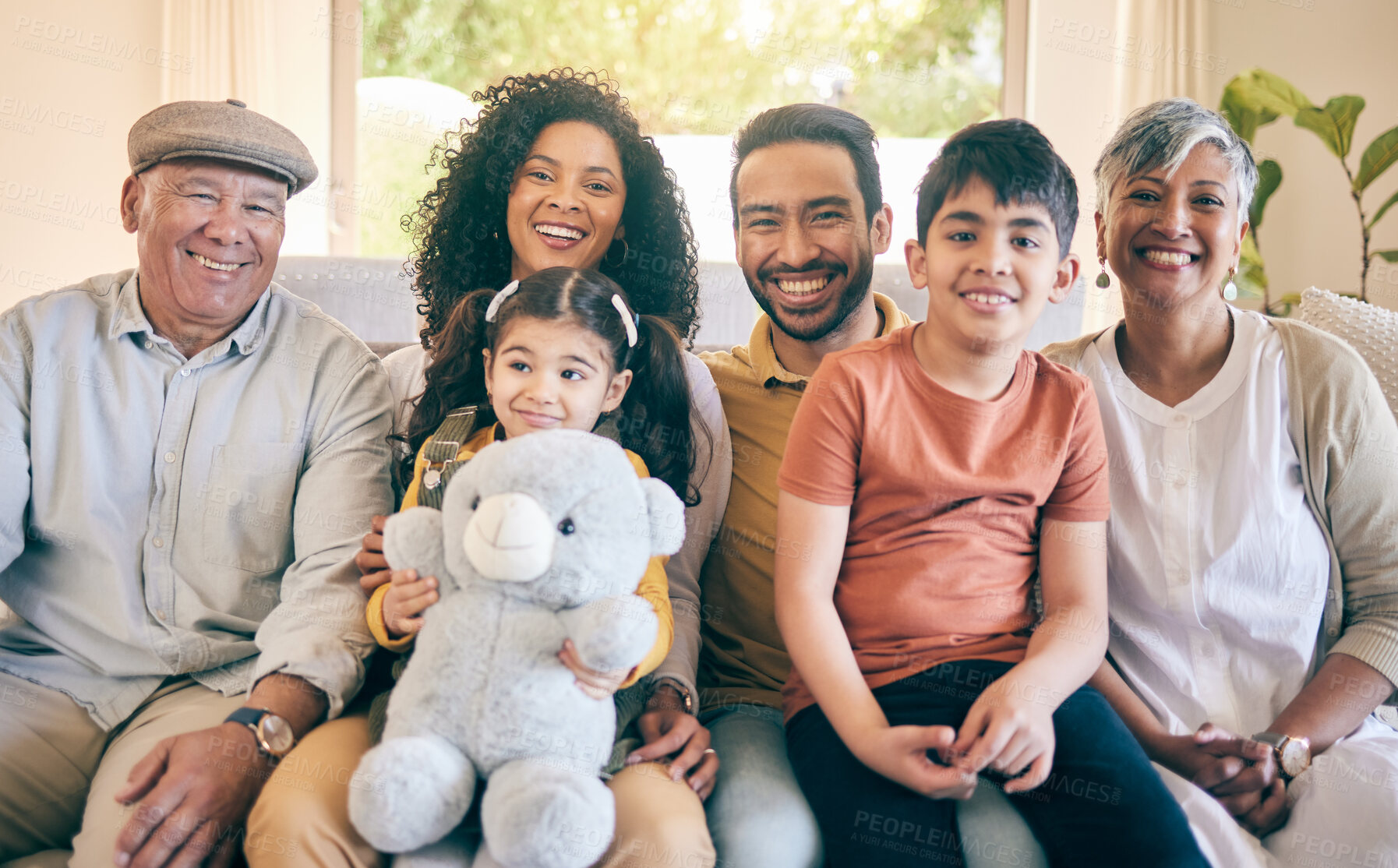 Buy stock photo Portrait, smile and big family in home living room, bonding and having fun together. Happy, children and grandparents, mother and father in lounge on sofa with care, love and interracial connection