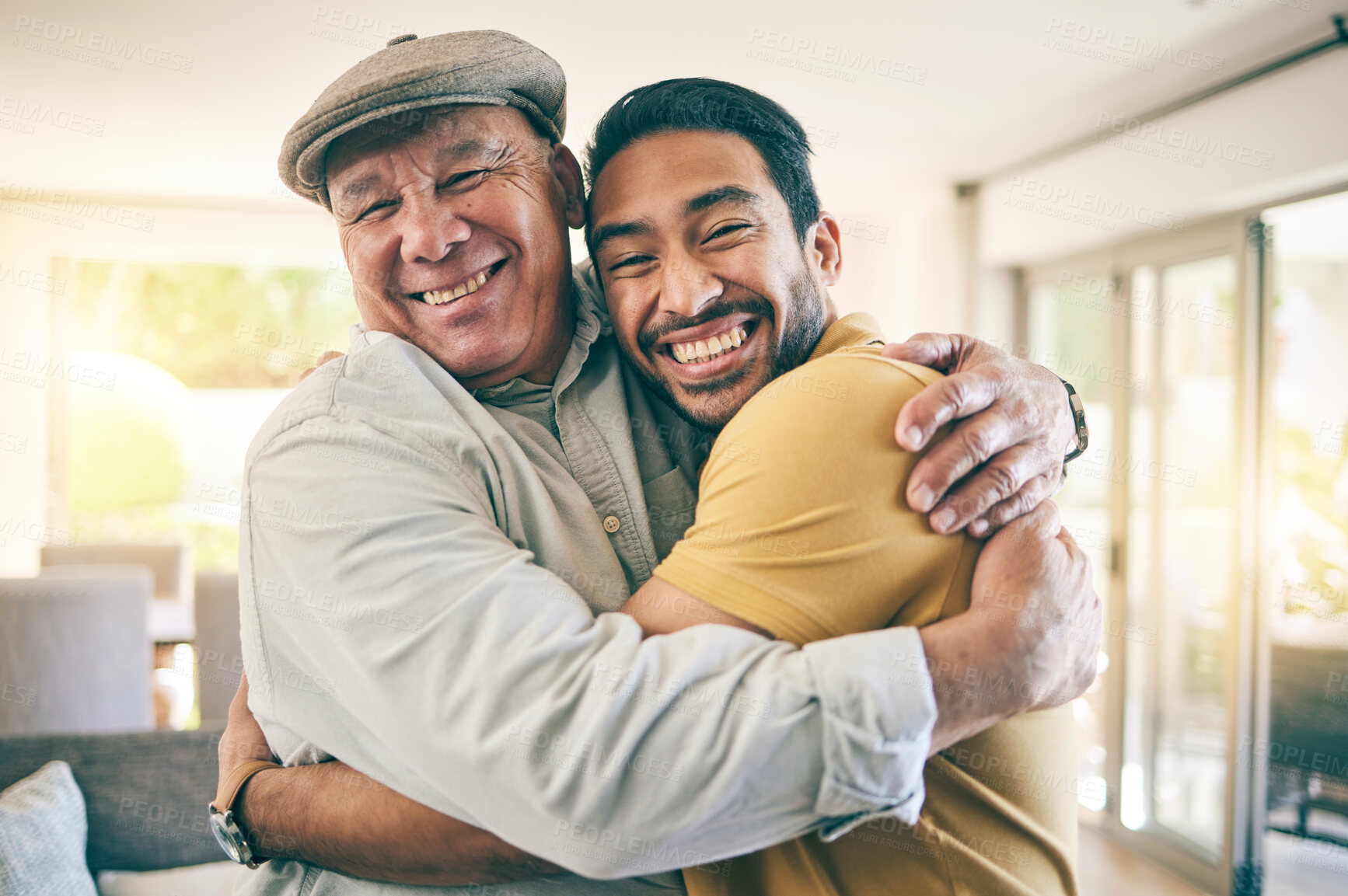 Buy stock photo Hug, portrait and man with his senior father for bonding, love and care in the family home. Smile, happy and excited young male person embracing elderly dad in retirement at a modern house in Mexico.