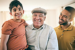 Portrait of child, father and grandfather at home with happiness, proud smile and fun. Boy kid, senior man and parent relax together as male family with love, care and joy in a living room for visit