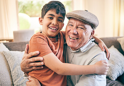 Buy stock photo Happy, hug and portrait of child with his grandfather on a sofa in the living room for relaxing and bonding. Smile, love and senior man sitting and embracing a boy kid in the lounge of family home.