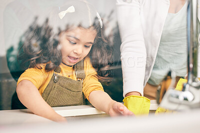 Buy stock photo Girl, learning and washing dishes with mom in kitchen, help or show skills in house for development. Cleaning, mother and daughter by sink, hygiene or teaching with support, bacteria or dirt in home