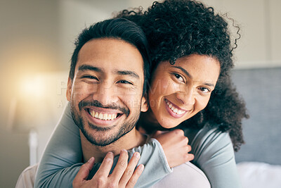 Buy stock photo Couple, portrait and hug in bedroom, smile and love with bonding, care and trust in healthy relationship. Interracial, people relax at home and happy, romance and partner with marriage and commitment