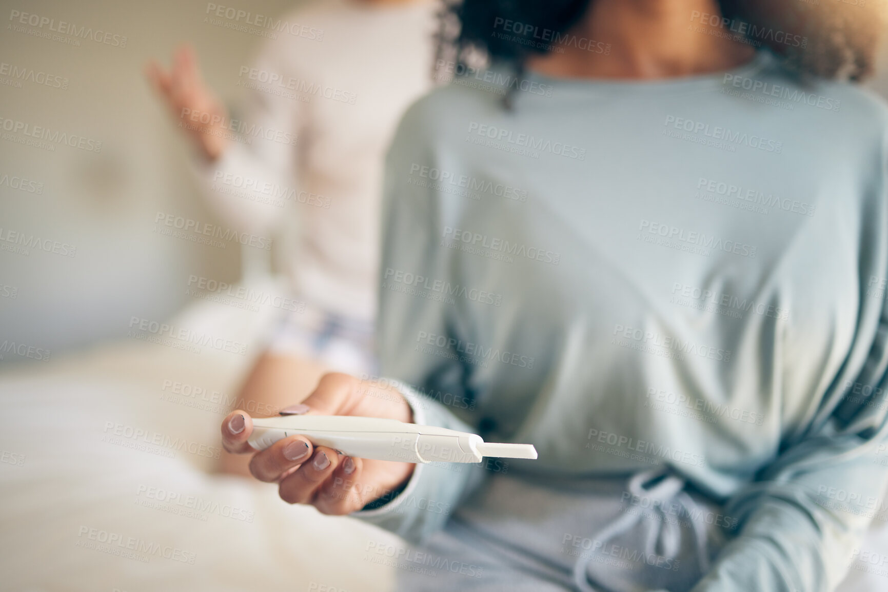 Buy stock photo Hands, woman and bed with pregnancy test, closeup and home for results, planning or news to start family. Girl, exam and notification in bedroom, apartment and anxiety for maternity, future or baby