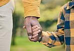 Nature, holding hands and family child, parent and walking in forest, woods and relax journey for love, care and support. Wellness garden, trust and young kid bond, connect and travel in outdoor park