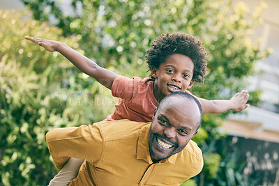 Buy stock photo Portrait, flying boy on the back of his dad and fun with a black family in the garden together for games and play. Face, smile and piggyback with a man carrying his son in the backyard of their home