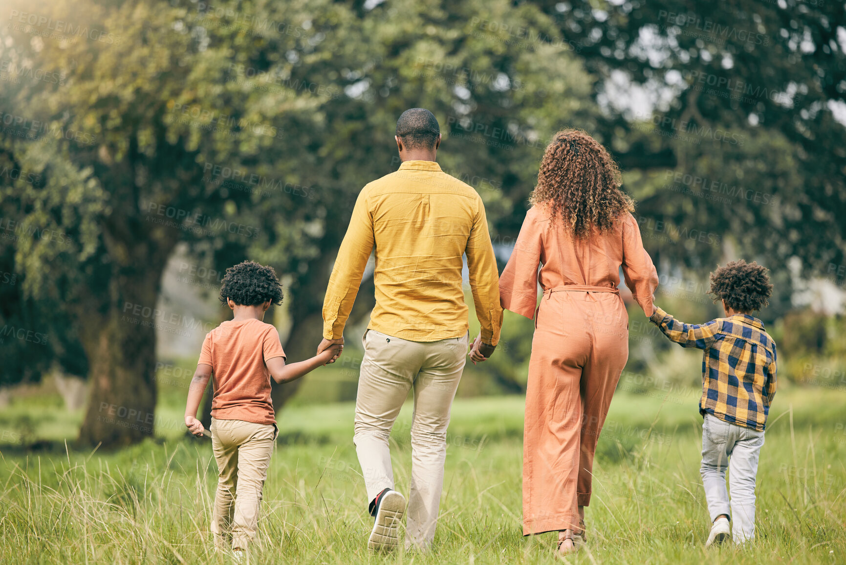 Buy stock photo Parents, holding hands or kids walking in nature, park or field on holiday vacation together as a family. Back of mother, father or children siblings bonding to relax in countryside for love or trust