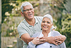Portrait, hug and happy senior couple in a garden with care, trust and conversation, support and love outdoor. Face, smile and elderly man embrace old woman in a backyard with fun in retirement