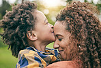 Love, kiss and mother with child in park for relax, bonding and happy. Care, support and smile with woman and young boy of black family hugging in nature for embrace, summer and happiness together