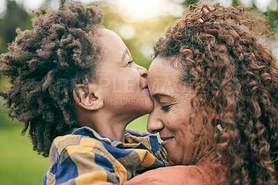 Buy stock photo Love, kiss and mother with child in park for relax, bonding and happy. Care, support and smile with woman and young boy of black family hugging in nature for embrace, summer and happiness together