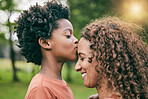Boy, kiss mother and forehead in park, smile or profile for love, care or bonding to relax in sunshine. African mom, child and happy in garden, backyard and countryside for smile, summer and holiday