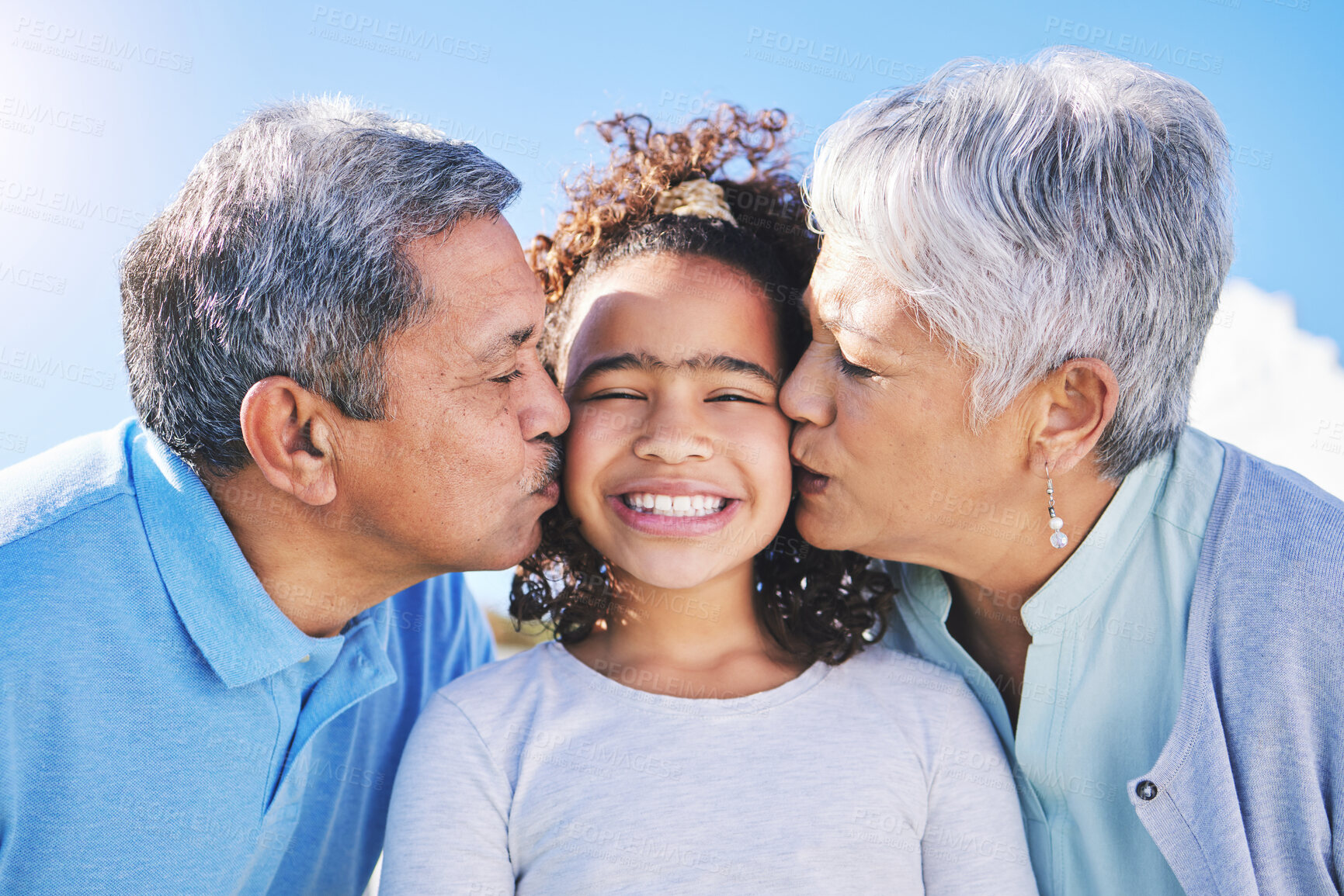 Buy stock photo Happy, sky or grandparents kiss child bonding in Brazil to relax with love, smile or care in retirement. Face, proud elderly grandmother or senior grandfather with kid on holiday vacation in summer