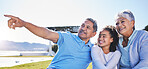 Happy, talking or grandparents with child in nature bonding to relax with care in retirement on mockup space. Smile, grandmother or senior grandfather pointing with a kid on holiday in summer park