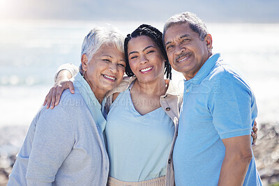 Buy stock photo Beach, portrait and woman with her senior parents hugging and bonding on vacation together. Happy, smile and female person embracing her elderly mother and father by ocean on holiday or weekend trip.