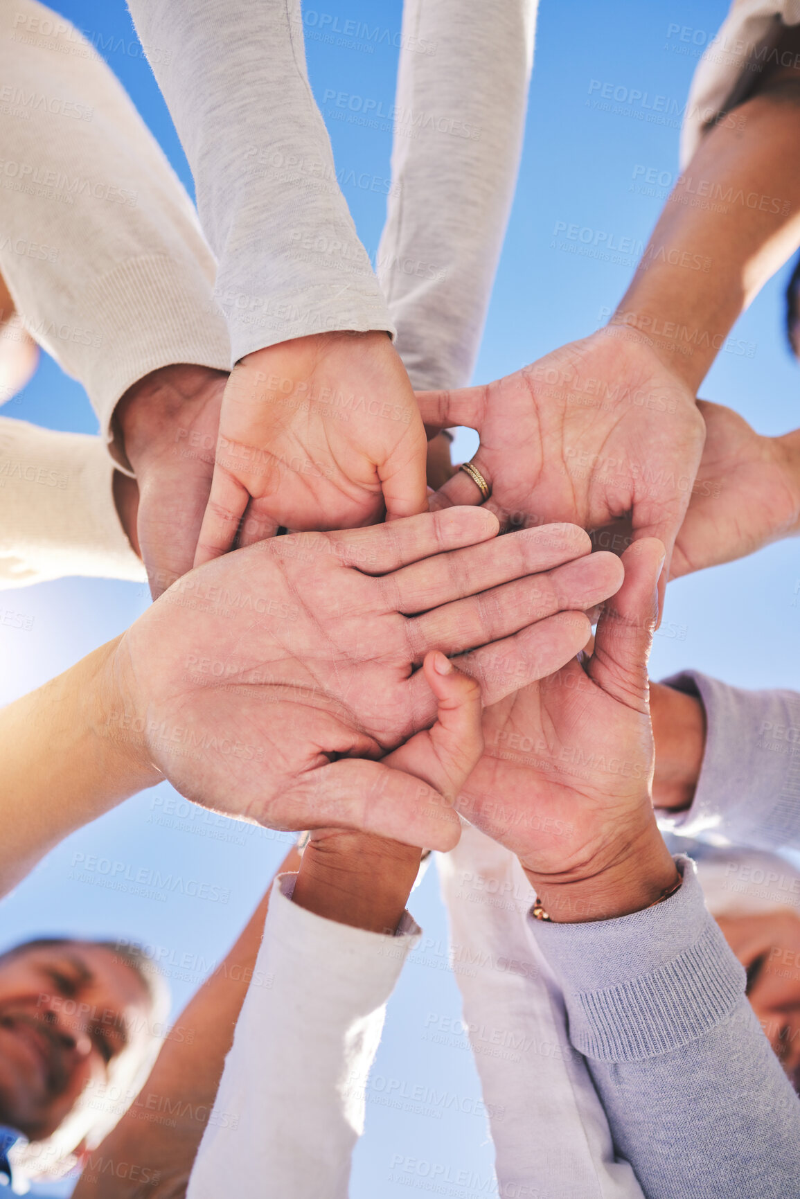 Buy stock photo Stack of hands, blue sky and diversity of people for community in collaboration for global support. Teamwork, palm and low angle of group of friends with positive vision, trust and love outdoors.