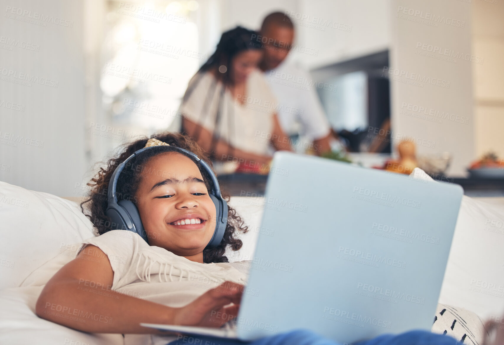 Buy stock photo Child, laptop and headphones on sofa for happy video streaming, audio subscription and e learning at home. Kid relax on couch listening to music, games and online education on computer in living room