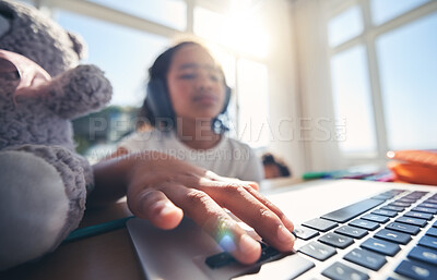 Buy stock photo Hand, laptop and homework with a girl in her bedroom for remote learning or private home school. Computer, children and education with a young female kid at a desk for growth or child development