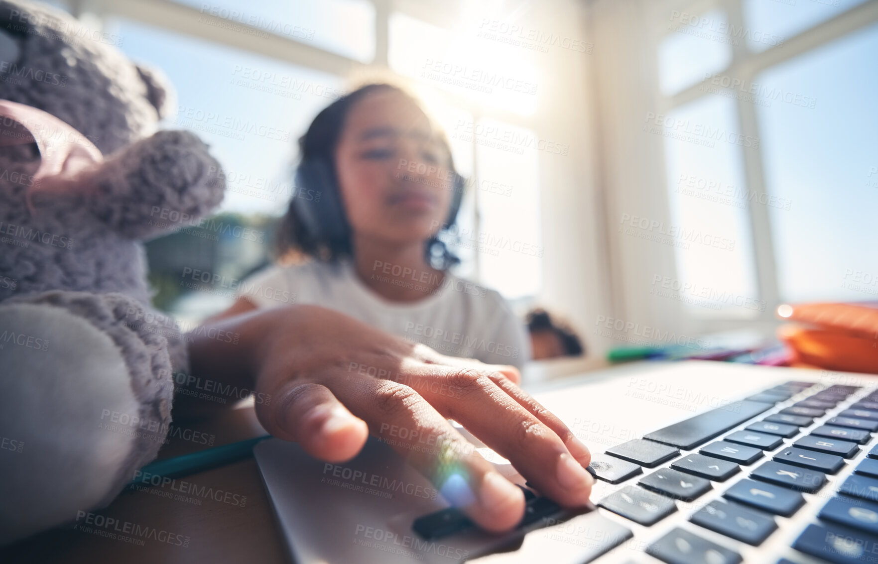 Buy stock photo Hand, laptop and homework with a girl in her bedroom for remote learning or private home school. Computer, children and education with a young female kid at a desk for growth or child development