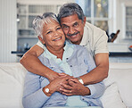 Portrait, senior or happy couple hug in house living room bonding together to relax on holiday with trust. Retirement, love or proud old man smile with a mature woman with support or care in marriage