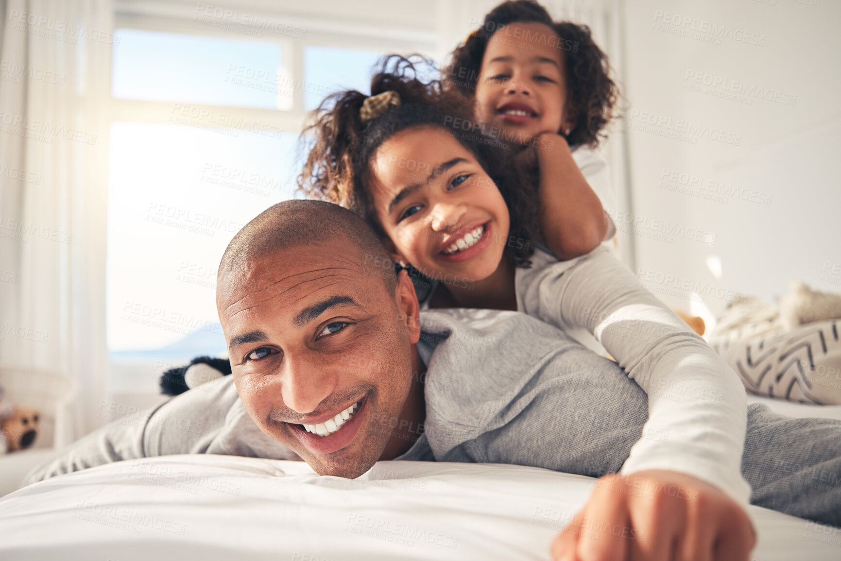 Buy stock photo Father, portrait and happy kids on bed in home, bonding and having fun together. Face, smile and dad with children in bedroom to relax with love, care and healthy connection for family in the morning