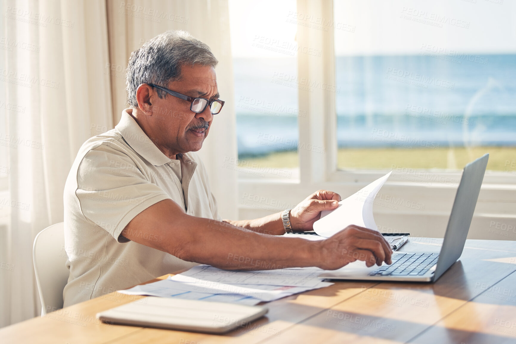 Buy stock photo Senior man, laptop and documents in budget planning, schedule payment or checking bills at home. Mature male person working on computer, paperwork or expenses in finance, insurance or retirement plan