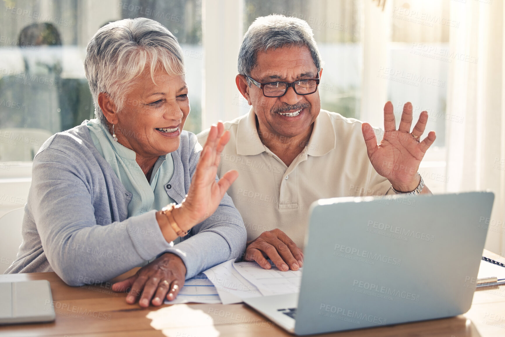 Buy stock photo Senior couple, laptop and hello in video call, virtual meeting or communication together at home. Happy mature man or woman waving or talking on computer in online conversation or discussion in house