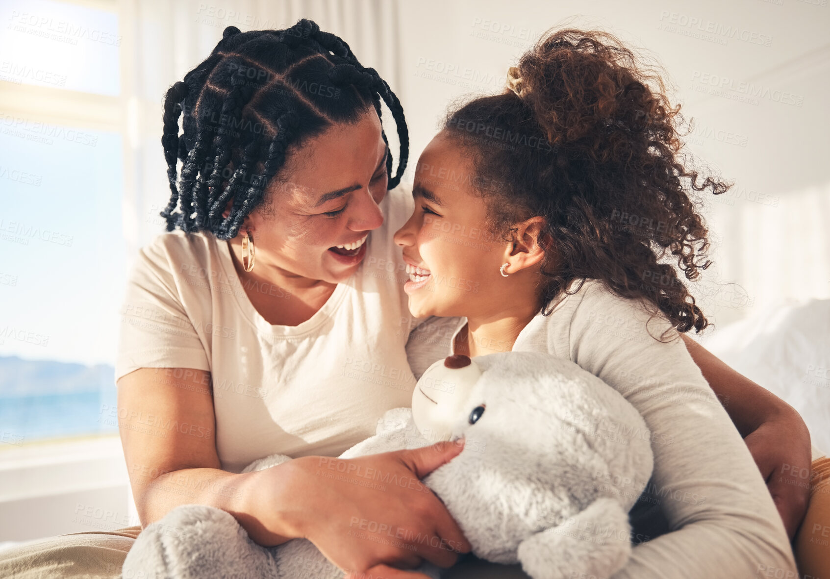 Buy stock photo Play, happy or mother with kid on bed in the morning with teddy bear, care or love in family home. Single parent, hug or funny mom with girl child in bedroom to laugh or relax with smile or freedom