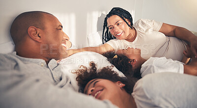 Buy stock photo Family, morning and happy in home bedroom bed playing, bonding and gratitude for love. African woman, man and kids lying together for security, support or relax with mother and father on holiday