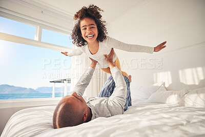 Buy stock photo Child, happy and parents on bed for airplane games, support and relax at home with crazy energy. Portrait of fun girl kid, dad and excited to fly in bedroom for freedom, fantasy and balance for play