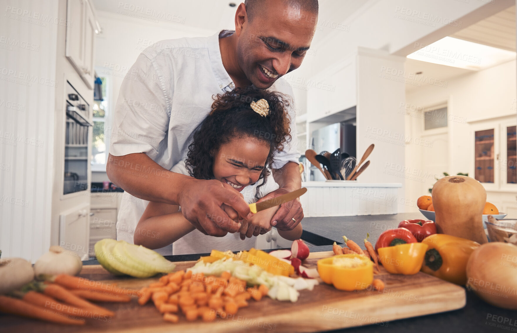 Buy stock photo Cooking, ingredients and father with girl in kitchen for child development, learning or teaching. Happy, bonding and dad cutting vegetables with kid for healthy dinner, supper or lunch meal at home.