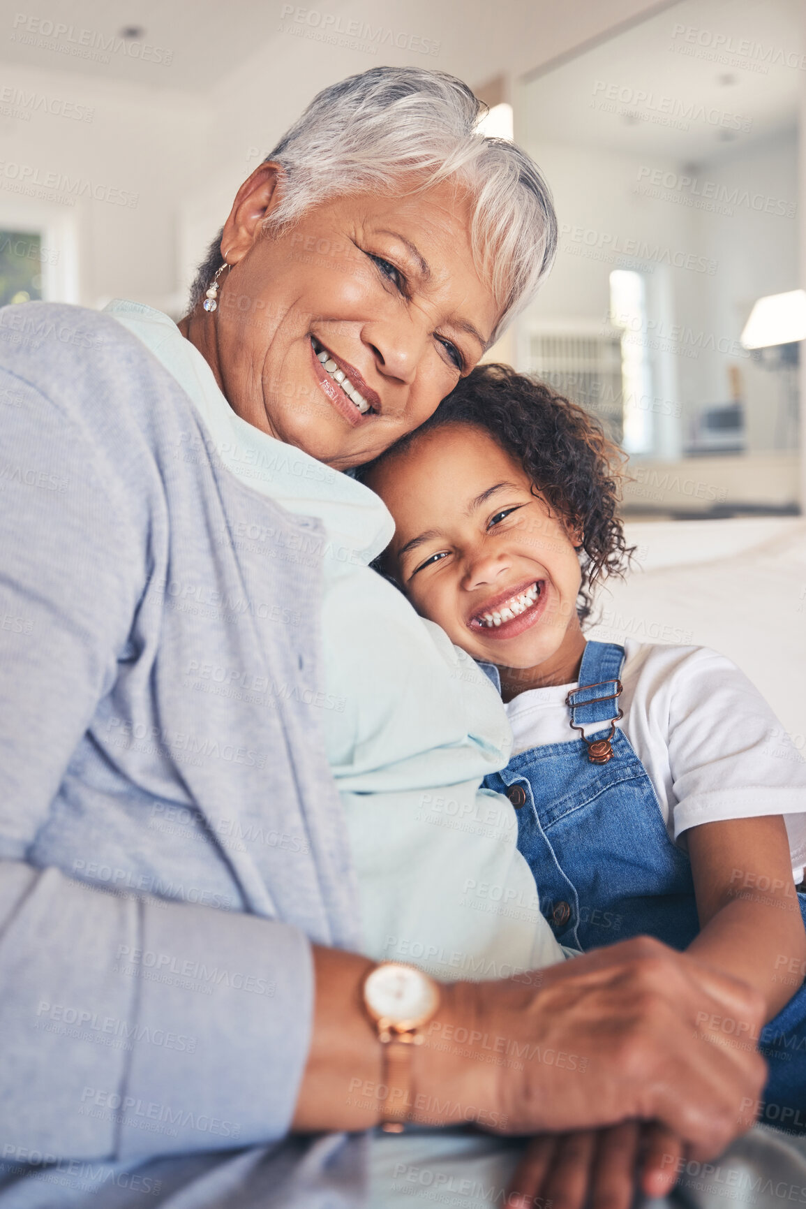 Buy stock photo Portrait, hug and grandma with girl, smile and bonding with weekend break, love and care in a living room. Face, granny or kid with happiness, home and support in a lounge, family or loving together