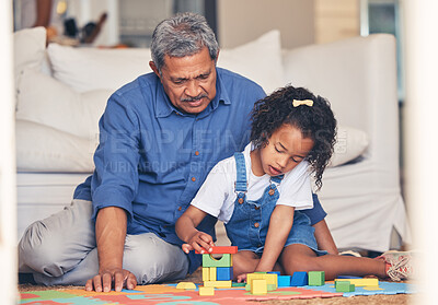 Buy stock photo Grandfather, building blocks and home with a kid and playing for development with family. Grandpa, young girl and living room floor together with care, support and youth game in a house with help