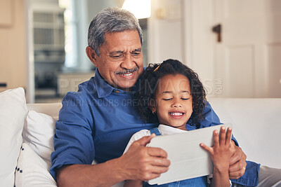 Buy stock photo Old man, kid and tablet, cartoon and relax together on sofa, bonding with online streaming and connection. Love, care and grandfather with child and technology, subscription and watch video or film