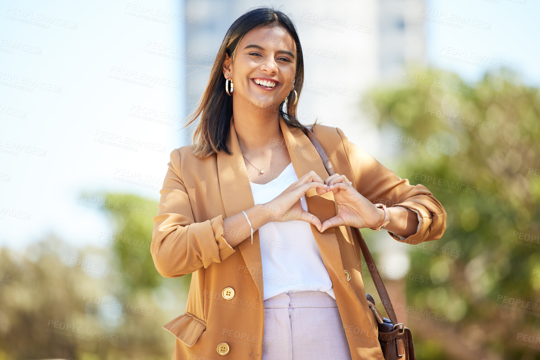 Buy stock photo Portrait, city and woman with heart sign, business and travel with support, emoji and kindness. Person, employee and worker with gesture, social media and outdoor with symbol for love, care and icon