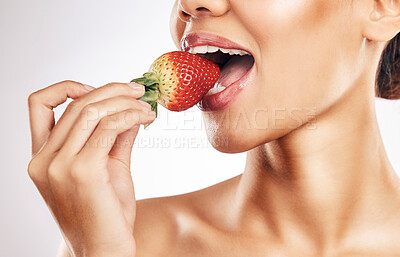 Buy stock photo Woman, strawberry and mouth for eating, studio and healthy with nutrition, diet and bite by white background. Girl, model and fruit for wellness, detox or cosmetics with detox, vitamin or vegan meal
