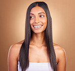Texture, hair and skincare with face of woman in studio for keratin, salon treatment and beauty. Shampoo, health and growth with Indian model on brown background for glamour, shine and hairstyle